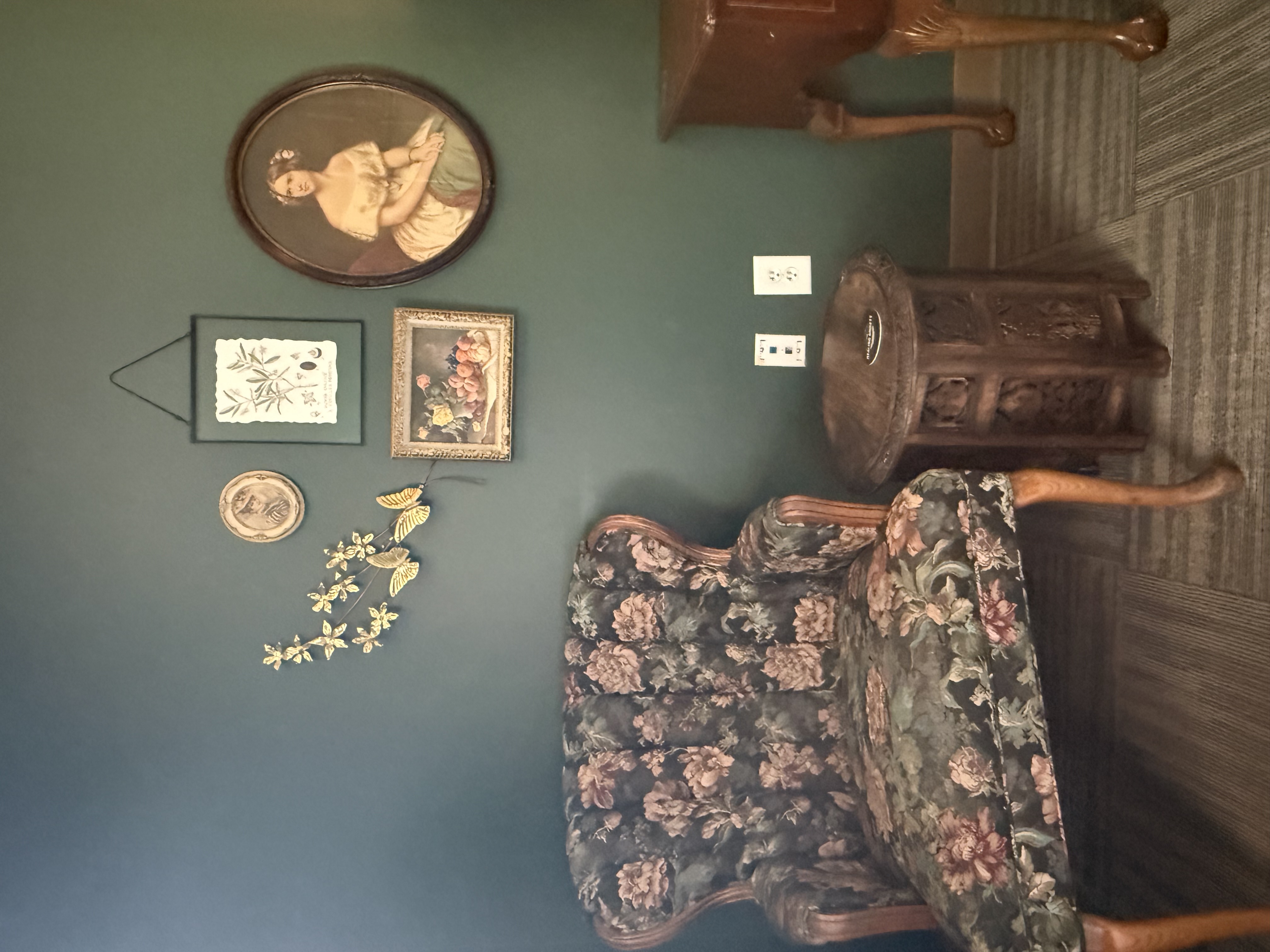 Floral armchair and carved side table in the East Nashville therapy office